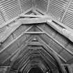 Fernaig cruck-framed barn, interior.
General view of roof beams from South.