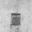 Detail of heraldic panel on S front.