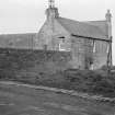 General view of Marine Inn, 40-5- Shore Street, Thurso with woman haning laundry.