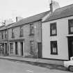 View from west of High Street, Coldstream, showing Geo W Gibson & Sons Commercial Printers and Stationers and R Scott & Son Booksellers