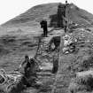 View of Vere Gordon Childe's excavation at Maes Howe, showing Childe on site at the opening of the site