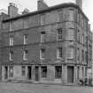 View of the corner of No. 124, 126, 128 Pleasance and No. 1 Salisbury Street, Edinburgh seen from the south west, showing The Crags pub.