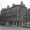 View of the corner of No. 124, 126, 128 Pleasance and No. 1 Salisbury Street, Edinburgh seen from the west south west, showing The Crags pub.
