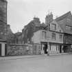 View of Huntly House and Acheson House, Canongate and the entrance to Bakehouse Close, showing the premises of George Period Furniture, David Murray Wines & Spirits and the Scottish Craft Centre