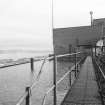 Exterior view across the Brown Water Roof Tanks, supplied by water from Loch Thom, and used for condensing the hot vacuum pan vapours.  The tanks were situated on the roof of the Fine End building  (T&L No.: 21180/3)