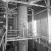 Interior view within boilerhouse of chimneys at the rear end of the three boilers (T&L No.: 21182/7)