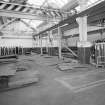 Motherwell, Craigneuk Street, Anderson Boyes
Plate Cutting (adjacent to Dept. 21, built 1943): Interior view from SE showing area where steel plate is cut into pieces used to fabricate casings and parts for coal cutting machinery.  Note also the re-inforced concrete frame of the building.