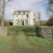 View of farmhouse from gates to South.