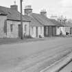 General view of north side of Victoria Street, Kirkpatrick Durham, from south west