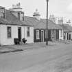 View of north side of Victoria Street, Kirkpatrick Durham, from south west