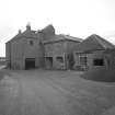 General view of mill from NW, showing two kilns on left, and extension undergoing conversion to dwelling on right.