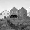 View of mill from S, showing water wheel house.