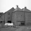 General view of mill from NE, prior to removal of building on E of mill.