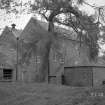 General view of mill from SE, prior to removal of building on E of mill.