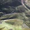 Oblique aerial view of Ewes Doors centred on the remains of a possible Roman watch tower and linear earthworks, taken from the NE.