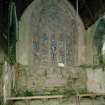 View of chancel: including East wall and stained glass window