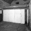 Stable, (former steading), interior view of stall showing Caithness slabs.