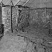 Auchindrain, Building N, interior.
View showing stumps of transverse and hip-end crucks..