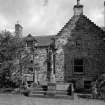 All Saints Episcopal Church.  
North East courtyard, view of war memorial from South.