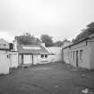 Edinburgh, West Mill Road, West Mills.
View from SW of cluster of single-storeyed brick-built buildings at NW end of the site, some of which were occupied by Bonaly Dairy.