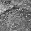 Excavation photograph : area F - loose unmortared stone rubble in angle between walls 26 and 31.