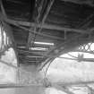 Linlathen East Bridge
Detailed view from S of underside of bridge, showing timber deck, iron spandrels, and raking iron tie-rods