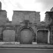 Detail of North East entrance with panel inscribed "BUILT 1865 ENLARGED 1883"