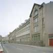 Oblique view from NW of W end of main facade overlooking Buccleuch Street.