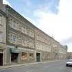 Oblique view from NE of main facade overlooking Buccleuch Street.