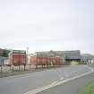 Distant view of the mill from SE, with Edinburgh Woollen Mills trailers in the foreground.