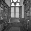 Detail of library shelving and window seat