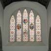 Interior.
View of stained glass window on East wall.