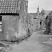 View of cottages and street in Balmblae, Falkland, from west