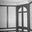 Interior. View of first floor South room/ drawing room from West showing closed china closet and panelling