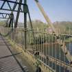Blantyre, Station Road, David Livingstone Memorial Footbridge
Slightly oblique view from W along deck near to centre of bridge, with the River Clyde visible through the railings