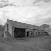 View of South range from North East with former granary with cartshed below and stables