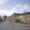 Oblique view from NE along Mansfield Crescent, showing northern part of works (still in use), with four-storeyed block in background (recently converted into flatted dwellings).