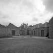 View from N of weaving sheds (left), and rear of block containing Engine and Boiler Houses (right).