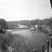 Low Blantyre, Hydro-Electric Power Station
Elevated general view from north of hydro-electric power station, showing weir across River Clyde (centre left), and turbine/valve house and fish ladder (centre right)