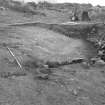 Excavation photograph : area I - general of features under southern rampart, from east.