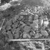 Excavation photograph : area III - heap of stone from rampart (to give idea of quantity)
