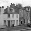 View of 5 and 6 Abbey Place, Jedburgh from west, showing Abbots Lea and T Cairncross confectioner and tobacconist.