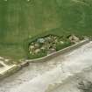 Oblique aerial view centred on the prehistoric settlement at Skara Brae