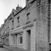 View of south elevations of 16 and 18 Canongate, Jedburgh, from east showing the premises of Robert Douglas.