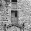 Detail of door pediment, windows and wall plaque, 36 Canongate, Jedburgh.