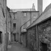 View of rear of 21 and 23 High Street, Jedburgh from Crown Lane from south east.