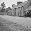 View of 83-95 Willoughby Street, Muthill, on north side of street including Dunsinnane, Haggart's Buildings, Belmont and Cottage Clare.