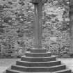 View of market cross in front of east end gable of 3 Stuart Street, Rothesay, Bute.