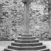 View of market cross in front of east end gable of 3 Stuart Street, Rothesay, Bute.