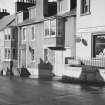 View of 65-69 Main Street, Glenluce, from north east, showing Auld King's Arms and Mrs. F. Laidlaw Confectioner.